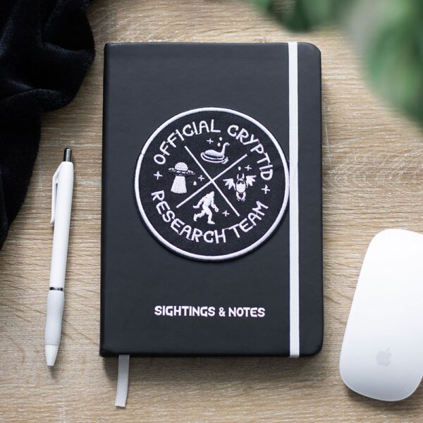 CX_89726.jpg Cryptid Research Team A5 Notebook - Book Decor